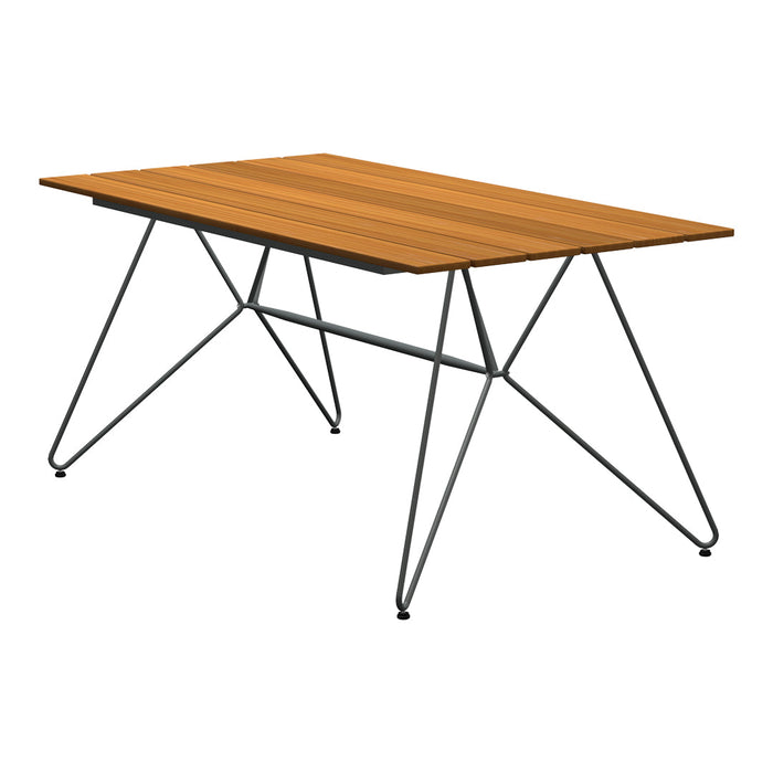 Modern rectangular table with a warm brown wood top and sleek black metal legs, showcasing a minimalist design.