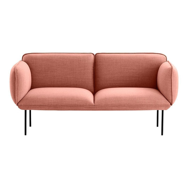 Stylish two-seater sofa in soft coral upholstery with smooth fabric and minimalist black metal legs.