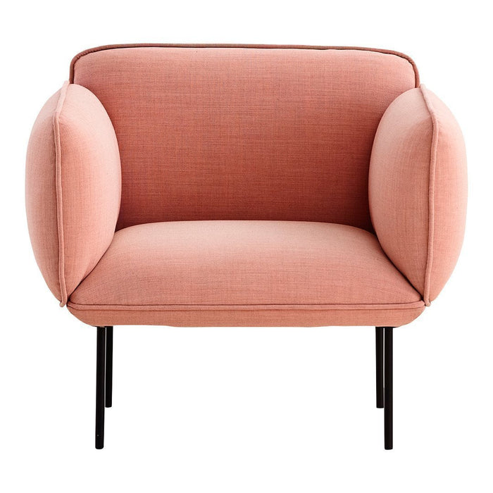 Peach-colored modern armchair with smooth fabric and rounded arms, set on sleek black metal legs.