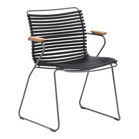 Black striped chair with wooden armrests, featuring a modern design and minimalist aesthetic. Perfect for any decor.