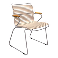 Beige striped chair with silver metal frame and light wood armrests, perfect for outdoor or modern interior decor.