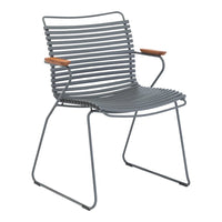 Gray striped chair with wooden armrests, showcasing a modern, minimalist design. Perfect for contemporary decor.
