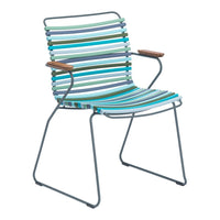Striped chair in vibrant teal, blue, green, and gray with natural wood armrests and a sleek metal frame.