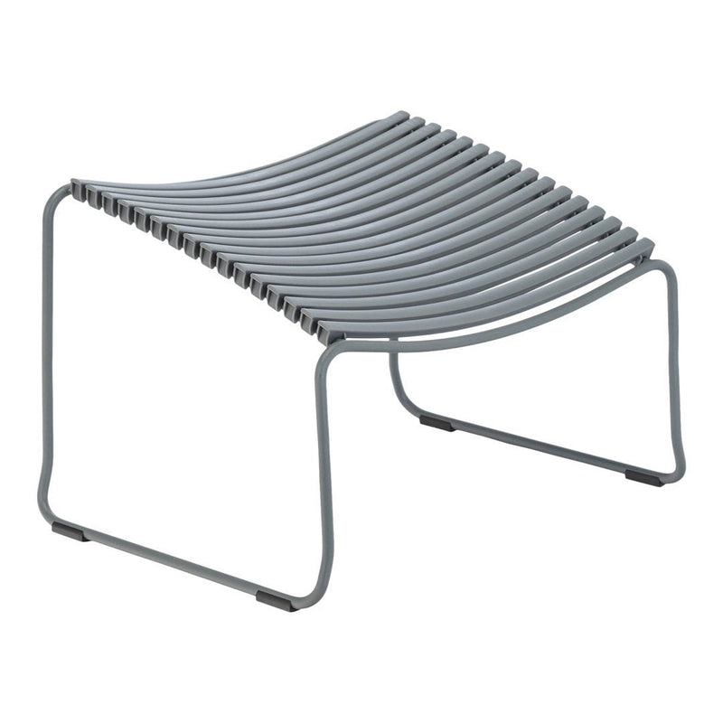 Gray curved slatted ottoman with modern minimalist design, featuring clean lines and a streamlined silhouette.