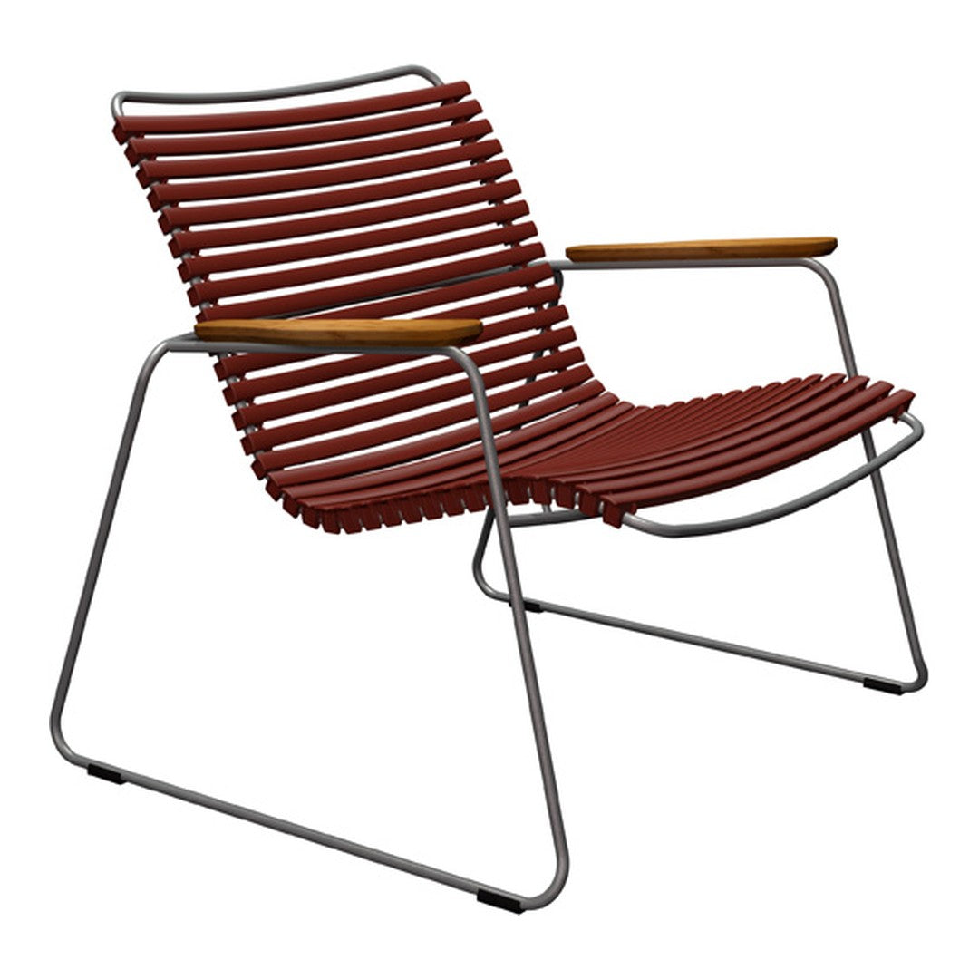 Rust-colored striped lounge chair with a sleek metal frame and wooden armrests. Modern, minimalist design.