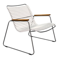 White striped lounge chair with natural wood armrests and a sleek metal frame. Ideal for modern outdoor decor.