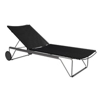 Black striped lounge chair with a sleek metal frame, perfect for outdoor relaxation. Stylish and modern design.