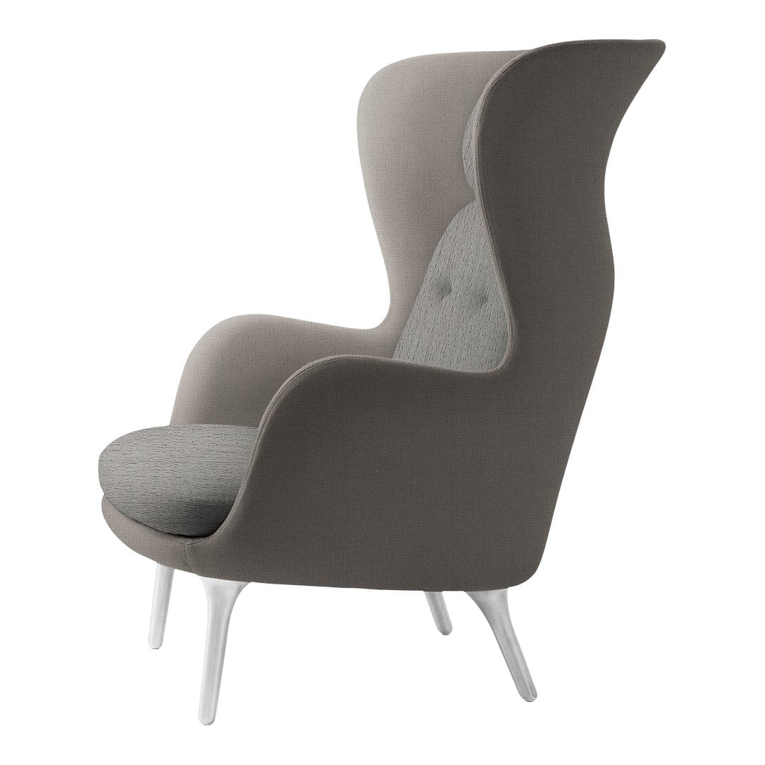 Two-tone grey upholstered armchair with smooth texture and subtle patterns, featuring white legs for modern elegance.