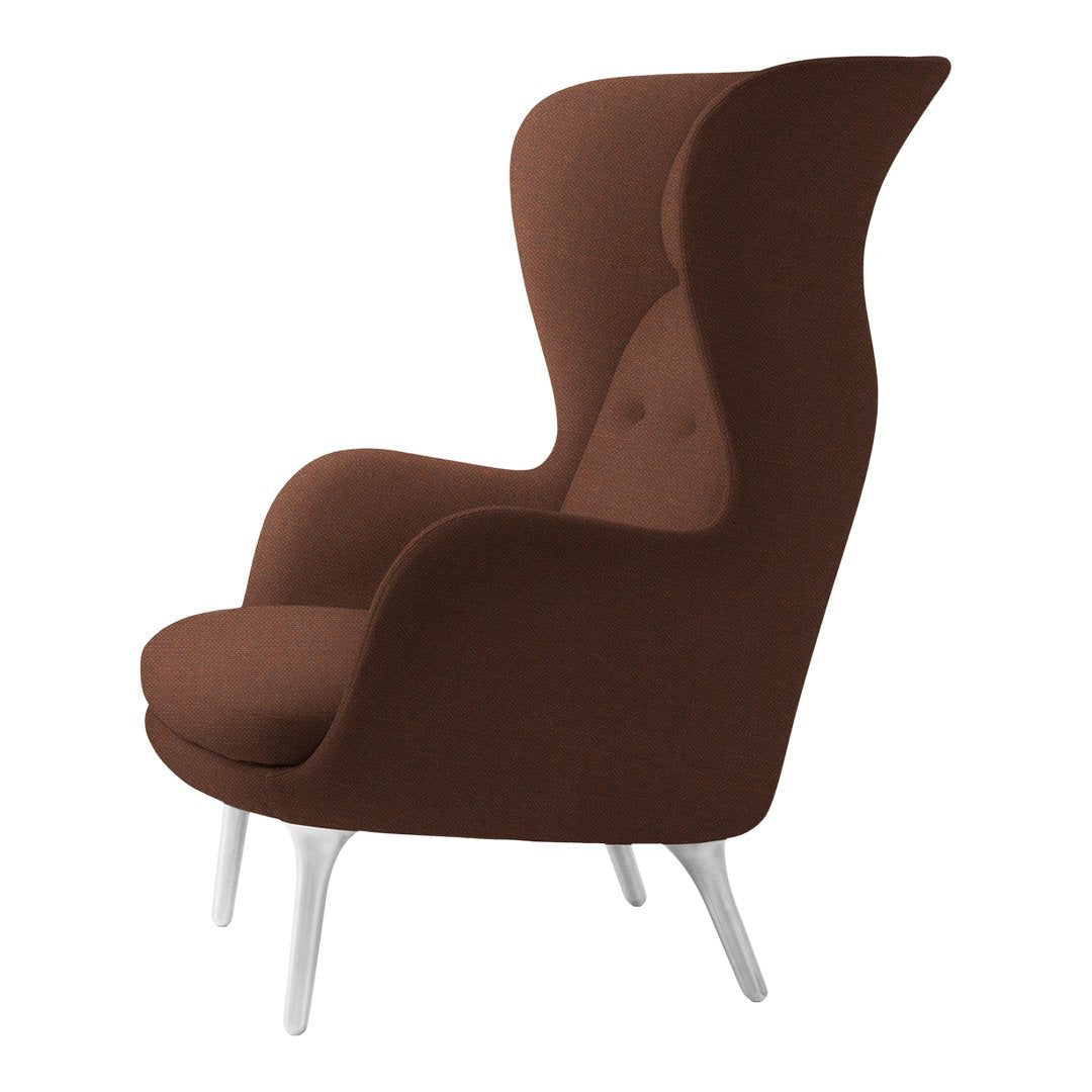 Brown upholstered armchair with a sleek, modern design and white legs, featuring a smooth color finish and subtle button details.