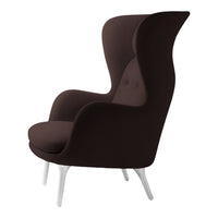 Brown upholstered chair with a sleek, modern design and subtle tufted detailing against white legs.