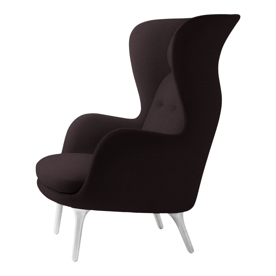 Stylish black upholstered armchair with a modern silhouette and sleek white legs, perfect for contemporary spaces.