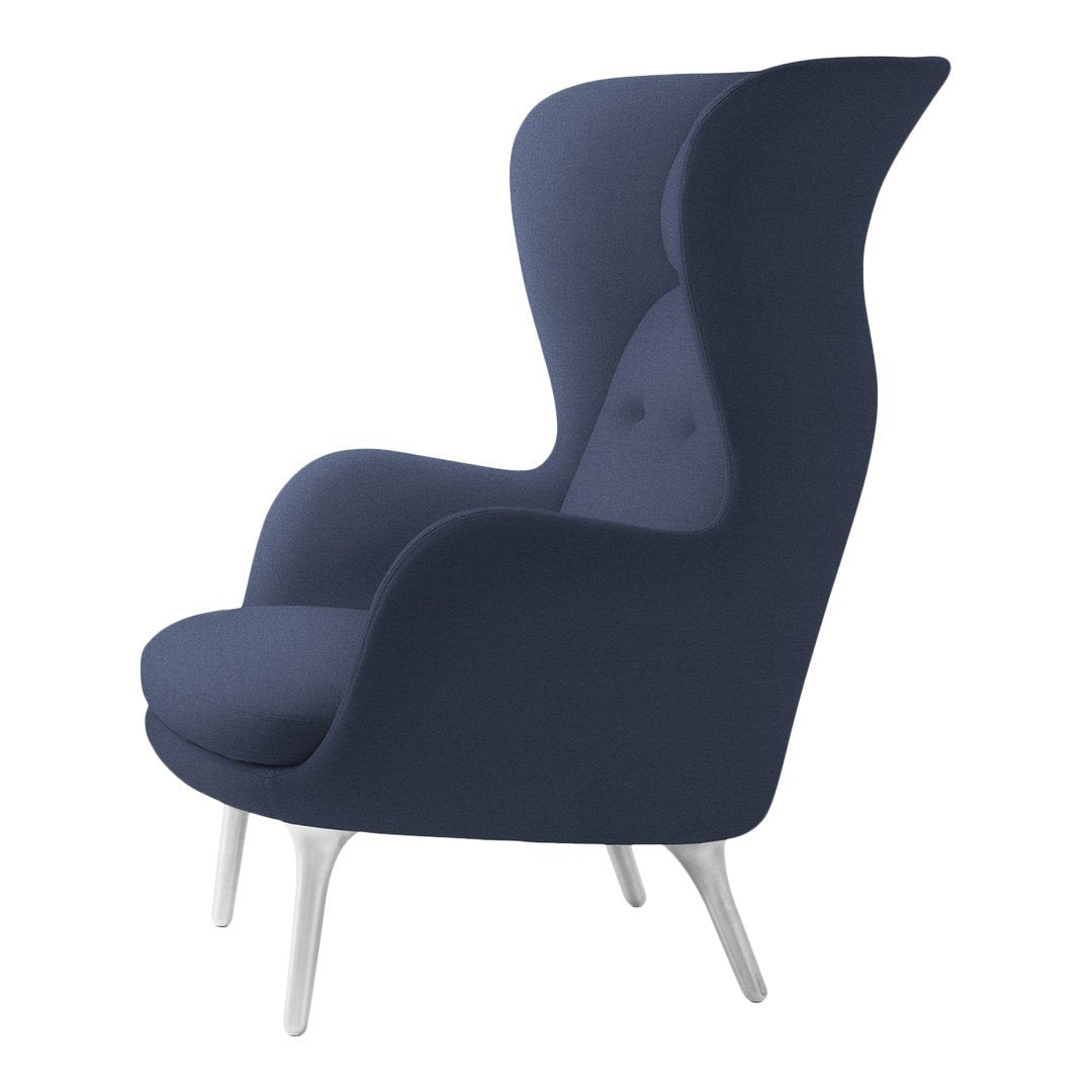 Elegant dark navy blue armchair with a smooth, minimalist design and sleek silver legs.