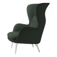 Stylish green upholstered wing chair with smooth fabric and sleek white legs, perfect for modern decor.