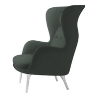 Elegant dark green high-back chair with smooth upholstery and subtle button detailing, set on white legs.