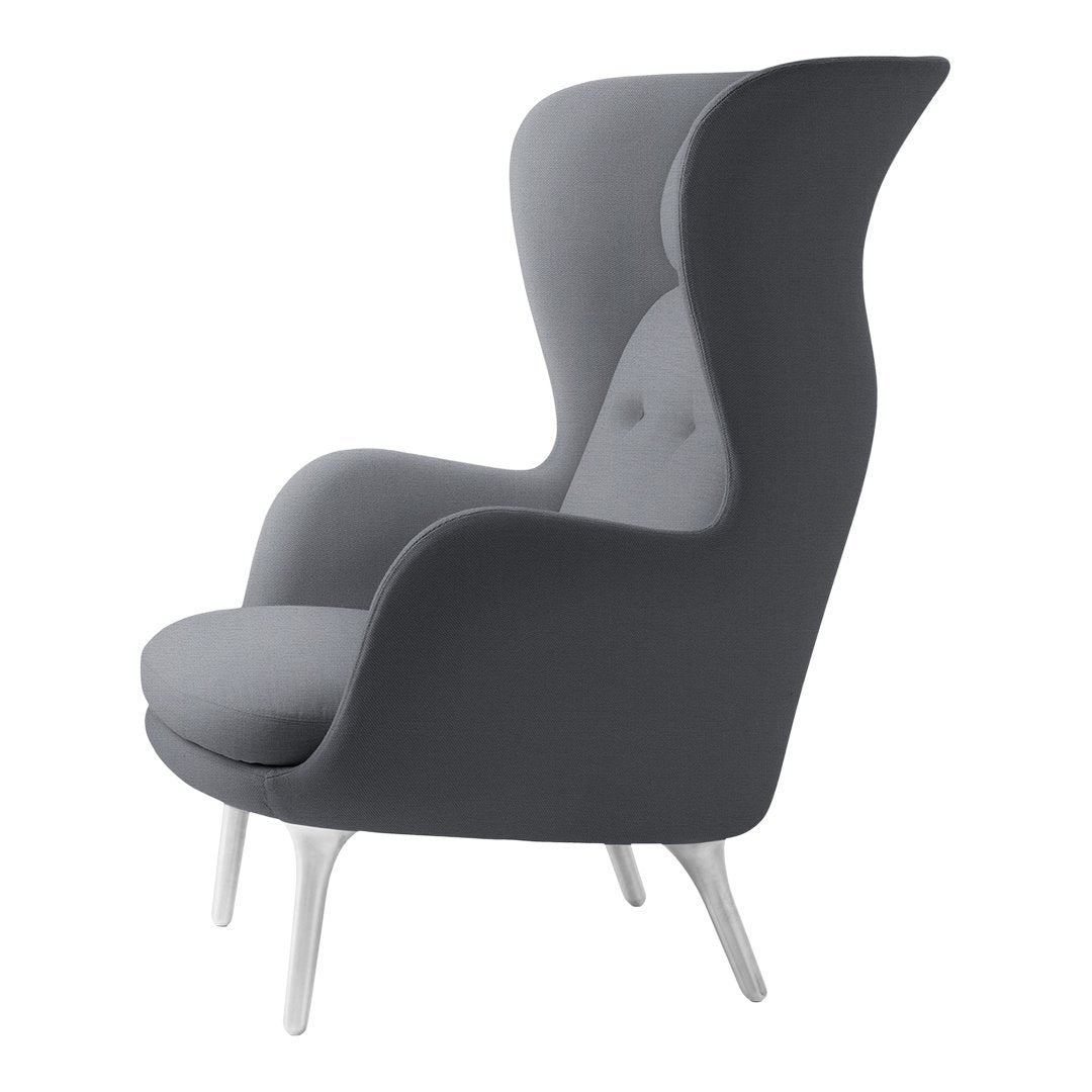 Elegant gray armchair with a smooth finish and subtle button detailing, perfect for modern interiors.