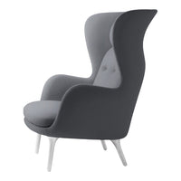 Elegant gray armchair with a smooth finish and subtle button detailing, perfect for modern interiors.