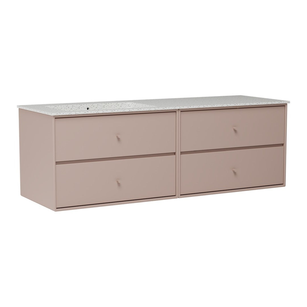 Blush pink dresser with four drawers and a smooth, light-colored top. Simple, modern design with minimalistic style.