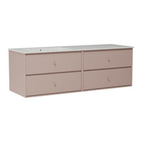 Blush pink dresser with four drawers and a smooth, light-colored top. Simple, modern design with minimalistic style.