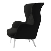 Sleek black upholstered chair with a modern silhouette and white legs, showcasing minimalist design elements.