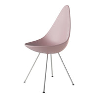 Minimalist pink chair with a smooth, curved design and sleek silver legs, perfect for modern decor.
