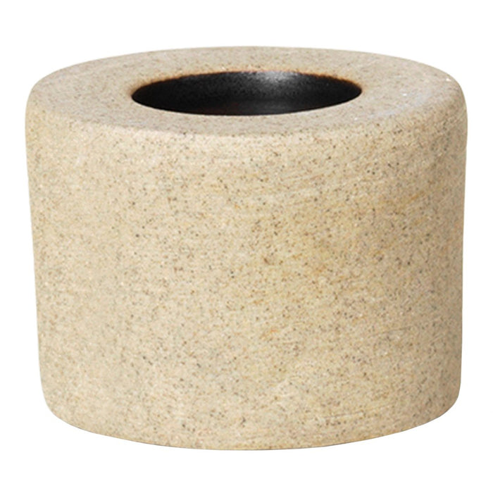 Textured beige planter with a smooth black interior, perfect for modern decor.