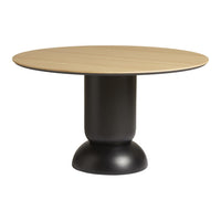 Round oak tabletop with a smooth black pedestal base, showcasing a modern and minimalist design in natural tones.