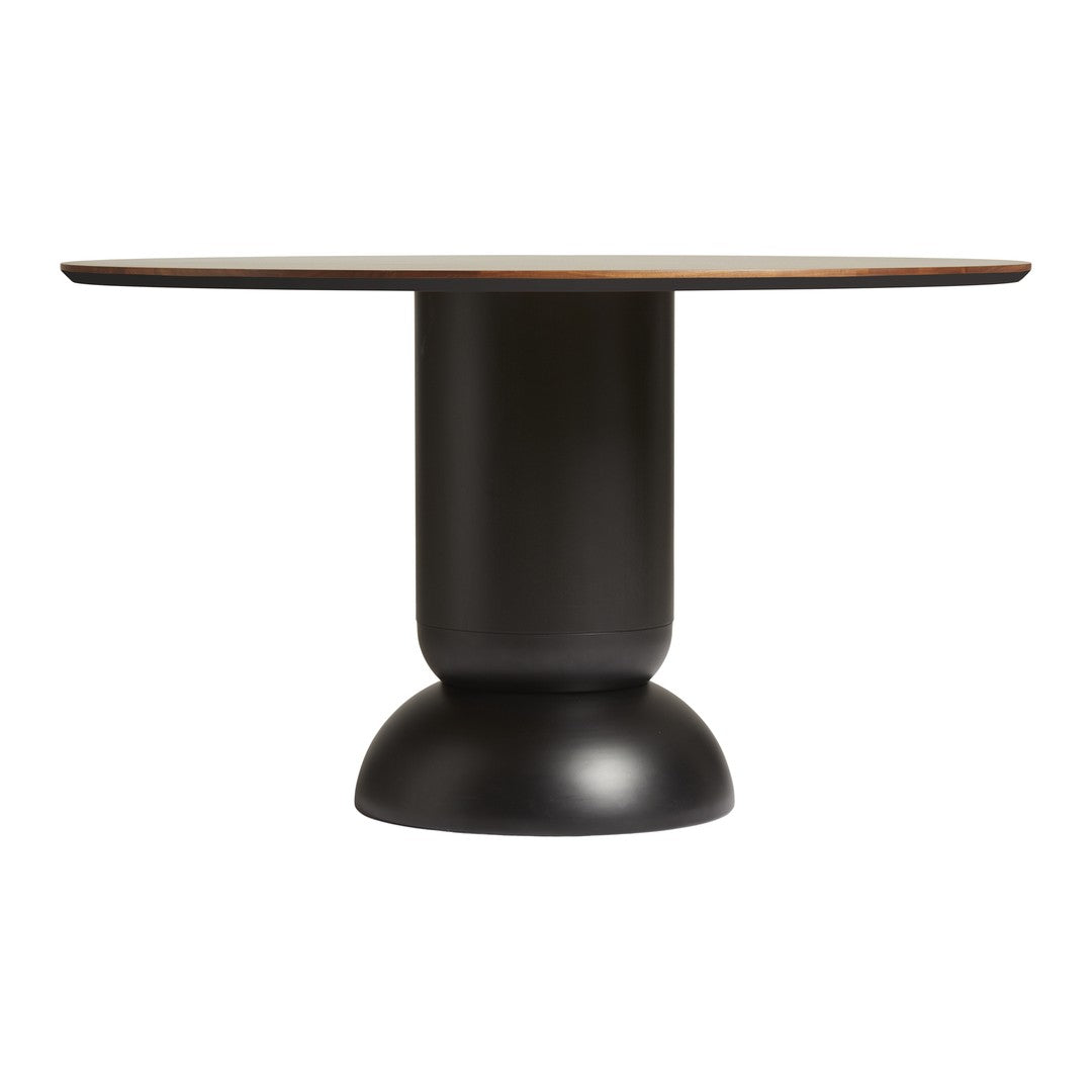 Round dining table with a warm wood top and a sleek black pedestal base. Modern, minimalist design with contrasting colors.