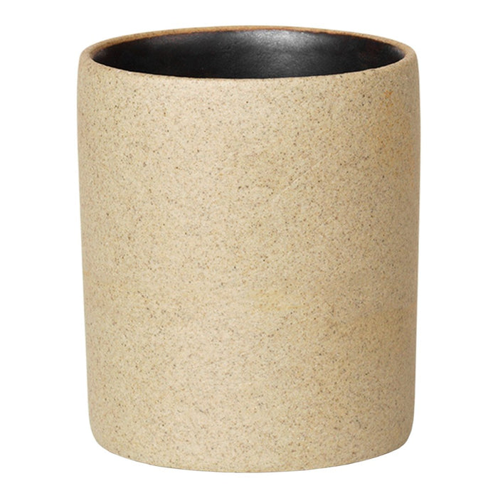 Beige textured planter with a smooth black interior, perfect for modern decor.