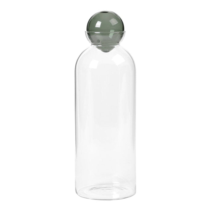Clear glass water bottle with a round green lid. Simple, modern design enhances any decor.