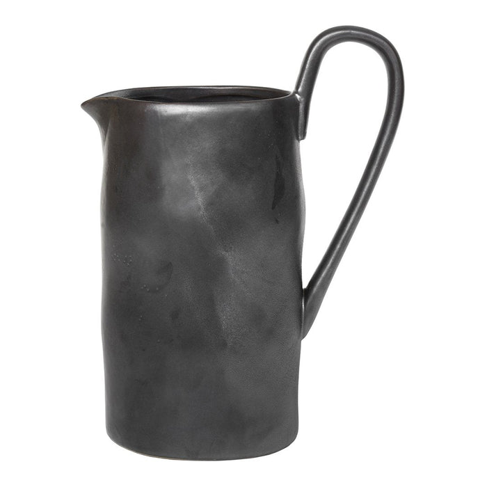 Black ceramic pitcher with a sleek, matte finish and subtle curved texture. Perfect for modern table settings.