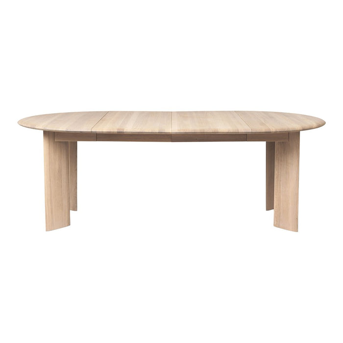 Light oak oval dining table with a smooth, natural wood grain finish. Modern design for stylish interiors.