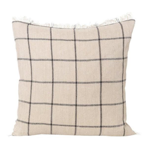 Beige plaid cushion with black grid pattern and fringe detailing, perfect for cozy home decor.