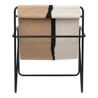Tan, cream, and black striped throw blanket displayed on a minimalist black frame.
