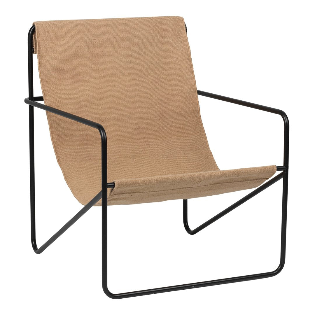 Minimalist tan fabric chair with a sleek black metal frame, featuring simple lines and a contemporary design.