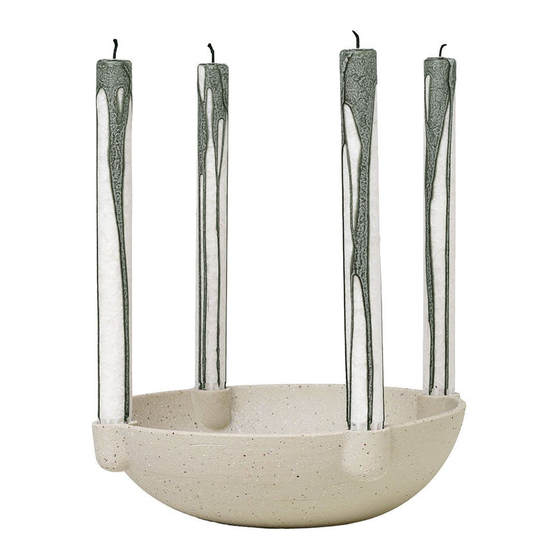 Cream bowl candle holder with green drip candles, featuring a minimalist design and smooth surface.