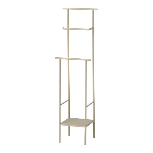 Beige metal standing shelf with a minimalist design, featuring three open shelves and a bottom storage area.
