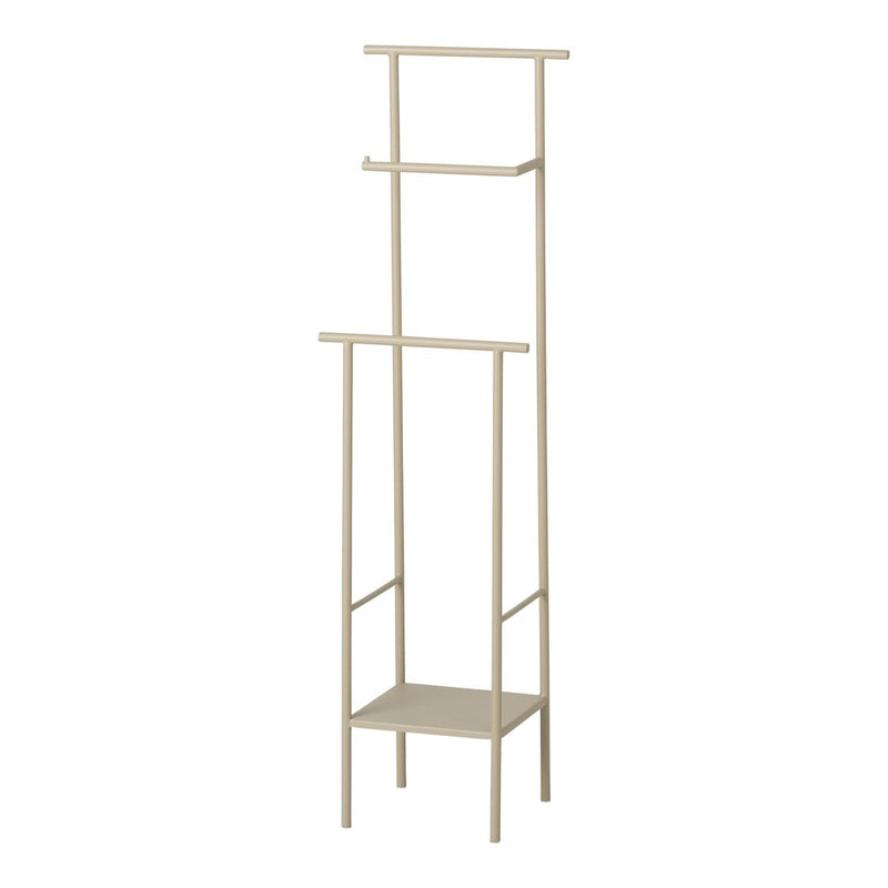 Beige metal standing shelf with a minimalist design, featuring three open shelves and a bottom storage area.
