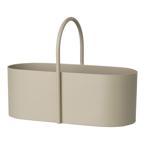 Light beige oval basket with a smooth, minimalist design and a curved handle, ideal for stylish storage solutions.