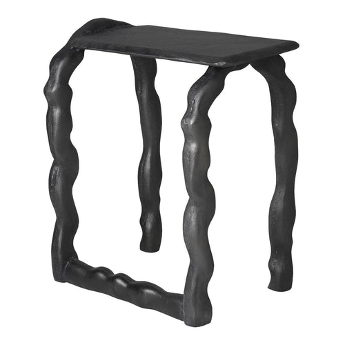 Black wavy side table with unique textured legs and a smooth top, perfect for modern decor.