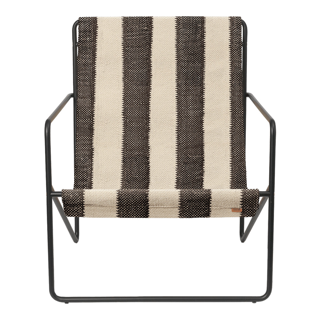 Striking black and cream striped pattern on a modern chair with a sleek metal frame. Perfect for contemporary decor.