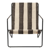 Striking black and cream striped pattern on a modern chair with a sleek metal frame. Perfect for contemporary decor.