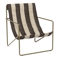 Striped lounge chair featuring bold black and cream color pattern on a sleek metal frame. Ideal for modern decor.