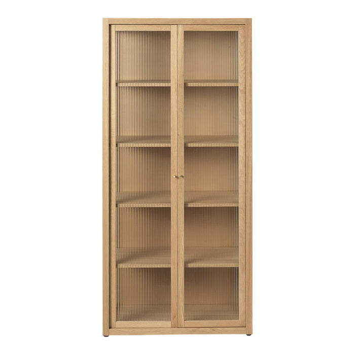 Light oak wood cabinet with a smooth finish and clear glass doors, featuring vertical ribbed patterns. Ideal for modern decor.