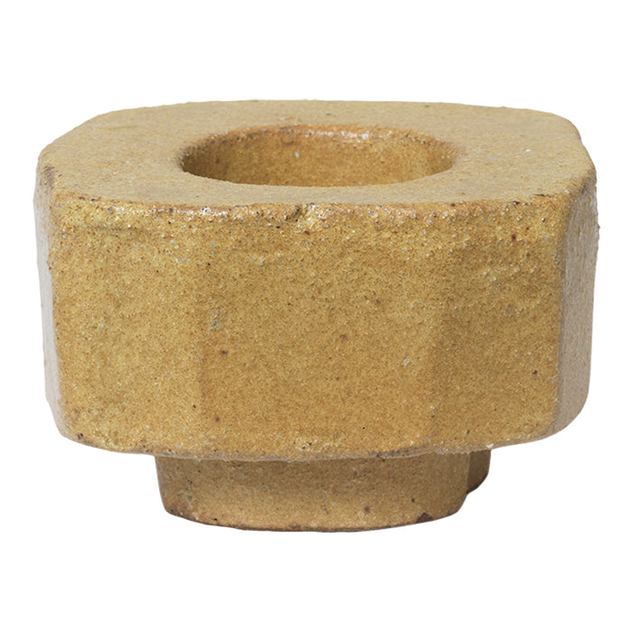 Square ceramic candle holder in warm beige with a textured finish and a center hole for holding candles.