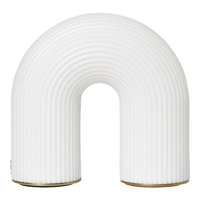 White ribbed arch lamp with a smooth finish and subtle gold base accents.