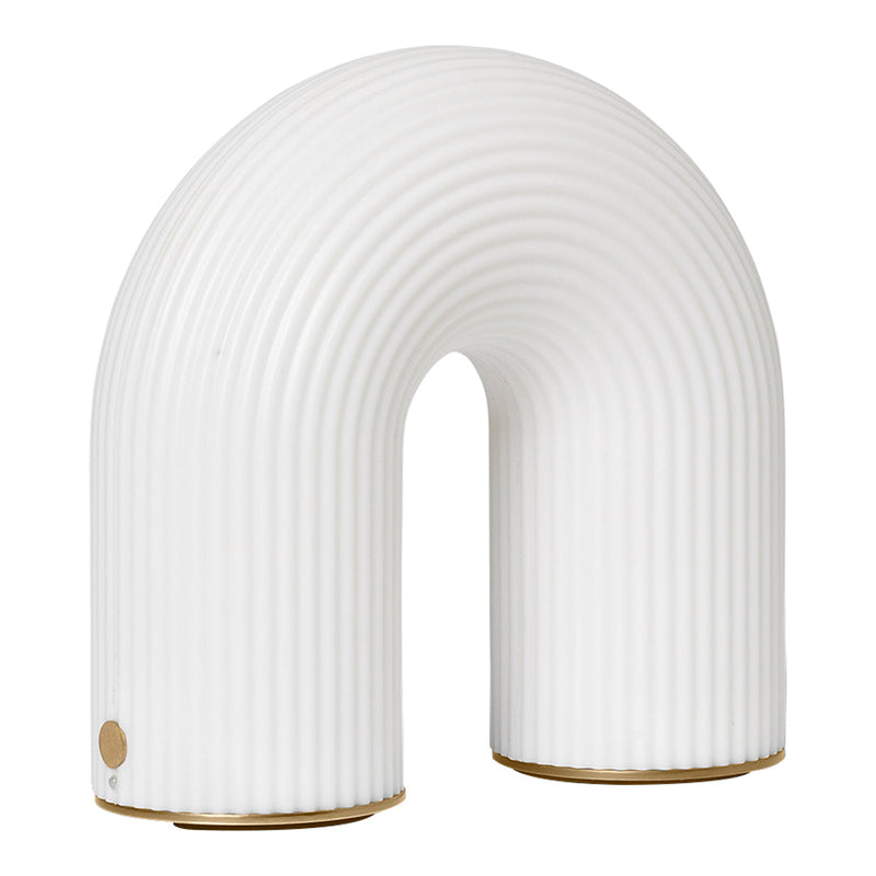 White ribbed arch lamp with a smooth finish and subtle gold accent, perfect for modern decor.
