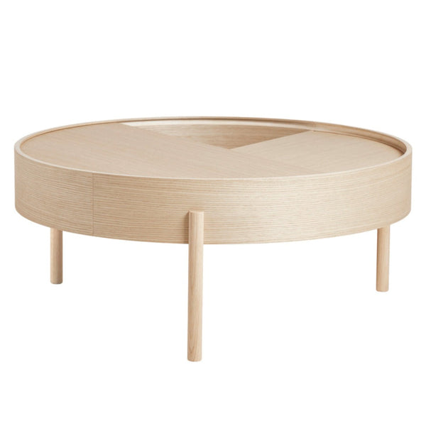 Round light wood coffee table with a smooth, minimalistic design and natural finish, featuring a geometric pattern.