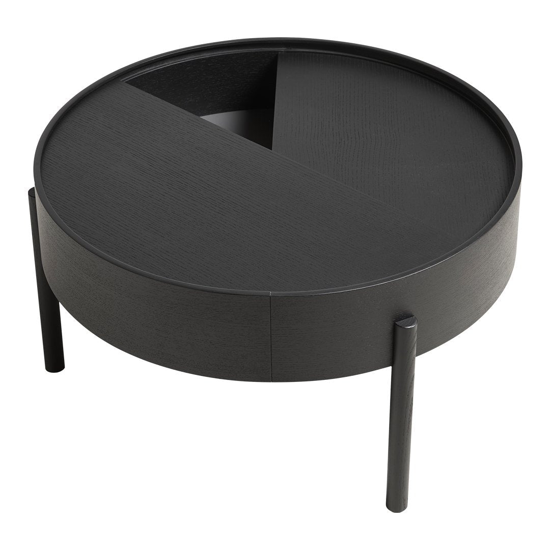Round black coffee table with a geometric pattern and a sleek, modern design. Minimalist style enhances any decor.