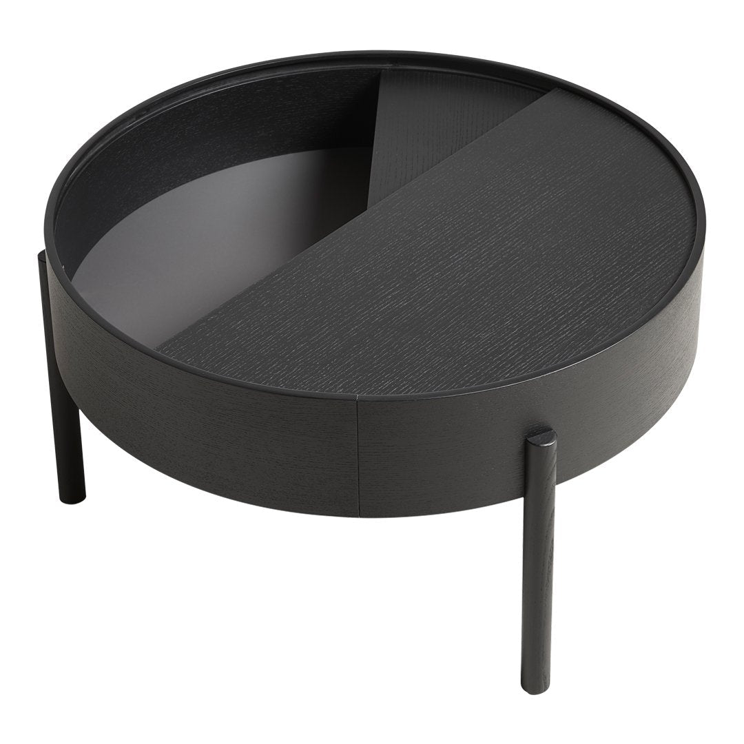 Round black coffee table with a split surface design featuring matte and textured finishes. Modern minimalist style.