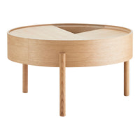 Light wood round coffee table with a smooth natural finish and minimalist design, featuring intersecting patterns on the surface.